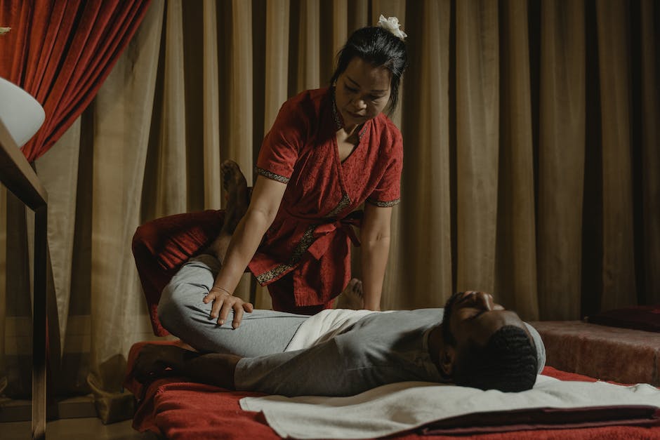 male massage therapist female client